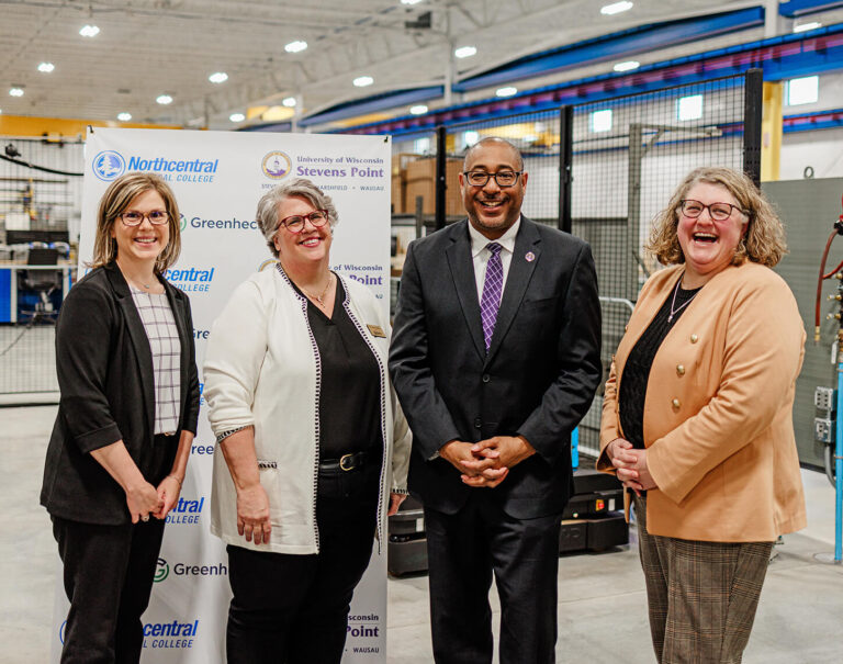 Greenheck Group employees celebrate the signing of a new degree completion program