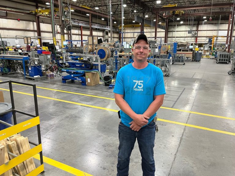 man standing in manufacturing facility