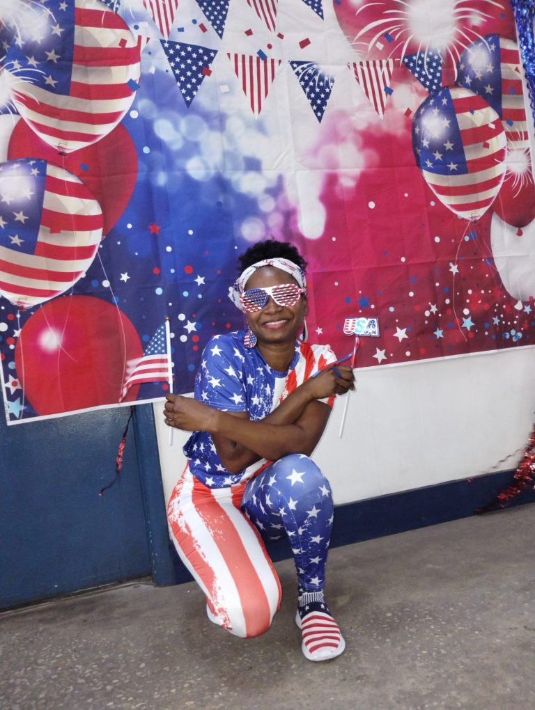black woman dressed in red white and blue