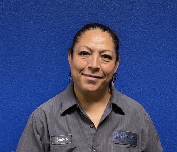 Woman in front of a blue background